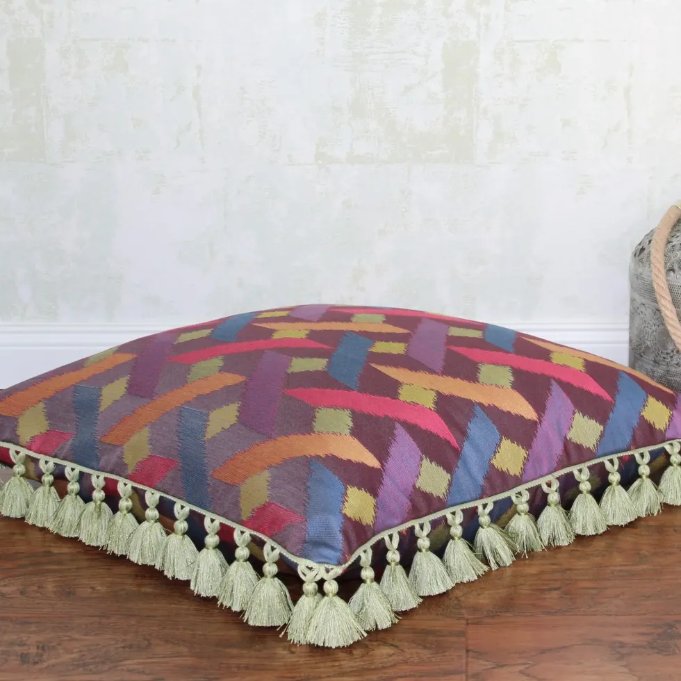 Kissen ECLIPSE AXIS magenta mit Quastenborte 60×60 cm